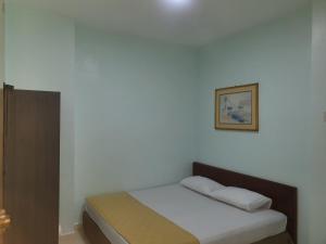Postel nebo postele na pokoji v ubytování Hotel Permai Melaka Raya