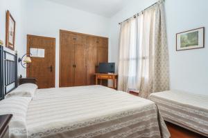 Postel nebo postele na pokoji v ubytování Hotel Marqués de Torresoto by Vivere Stays