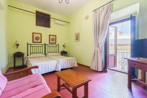 Postel nebo postele na pokoji v ubytování Hotel Marqués de Torresoto by Vivere Stays