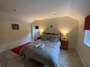 Postel nebo postele na pokoji v ubytování Deeside Snugs Apartments