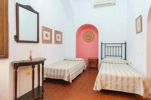 Postel nebo postele na pokoji v ubytování Hotel Marqués de Torresoto by Vivere Stays