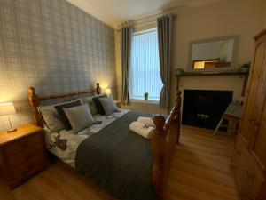 Postel nebo postele na pokoji v ubytování Deeside Snugs Apartments