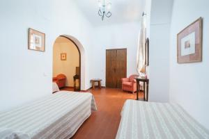 Postel nebo postele na pokoji v ubytování Hotel Marqués de Torresoto by Vivere Stays