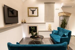A seating area at Porta Vetere - Boutique Rooms