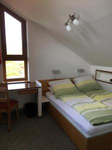 En eller flere senger på et rom på Ferienhaus Uferweg
