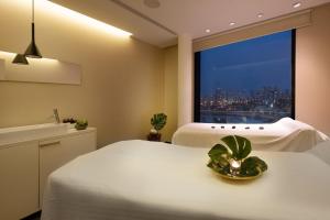 A bed or beds in a room at Vert Lagoon Netanya By AFI Hotels