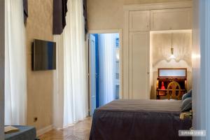 A bed or beds in a room at La Casa Sul Nilo