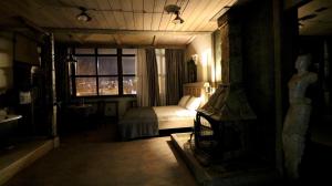 a bedroom with a bed and a window at Artists Residence in Tbilisi in Tbilisi City