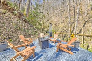 a group of chairs sitting on a gravel patio at The Lodge Nantahala River in Bryson City