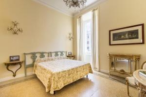 a bedroom with a bed and a fireplace at Rome Charming Suites in Rome