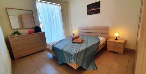 Voodi või voodid majutusasutuse Via Ugento Apartments - GiHome toas