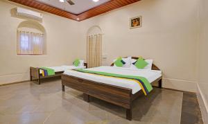 Treebo Cecil Resort, 600 Mtrs From Matheran Railway Station客房内的一张或多张床位