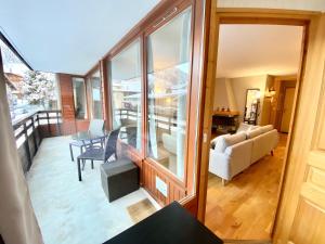 a view of a living room and dining room at Chalende in Morzine