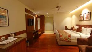 Ένα ή περισσότερα κρεβάτια σε δωμάτιο στο juSTa Grand View Resort & Spa, Manali