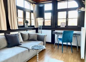 Część wypoczynkowa w obiekcie STADTVILLA BELLE KITZ im Zentrum mit Sauna by Belle Stay