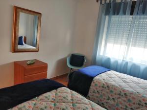 En eller flere senge i et værelse på Burgau Mar