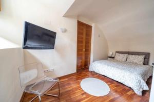 Postel nebo postele na pokoji v ubytování La Casa de San Justo - Living Toledo