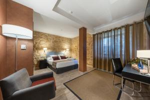 Cama o camas de una habitación en Castilla Termal Burgo de Osma