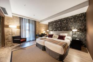 Cama o camas de una habitación en Castilla Termal Burgo de Osma