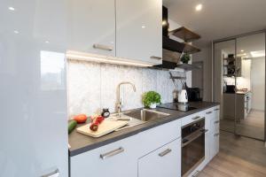 Kuchyňa alebo kuchynka v ubytovaní Ideal Apartments Grobla
