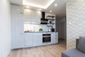 Kuchyňa alebo kuchynka v ubytovaní Ideal Apartments Grobla