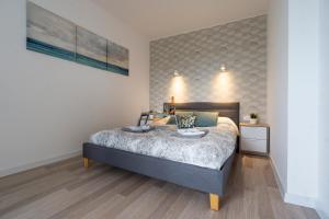 Posteľ alebo postele v izbe v ubytovaní Ideal Apartments Grobla