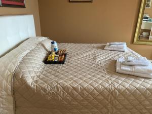 A bed or beds in a room at Villa Castello only room