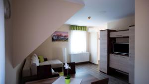 TV a/nebo společenská místnost v ubytování Irány Colorado Apartman