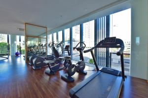 a gym with a bunch of cardio equipment in a building at The Landmark Penang in Tanjong Tokong +18 photos