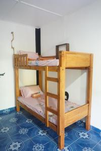 a couple of bunk beds in a room at Akki's Hostel in Trincomalee