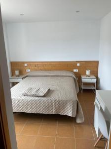 Cama o camas de una habitación en Hotel Antonio Ponz