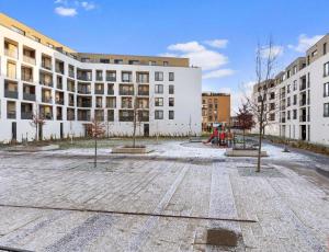 an empty courtyard in front of a building at Sunflower - Modern large charming apartment with balcony in Bratislava