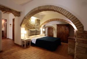 A bed or beds in a room at Corte dei Guelfi