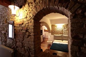 A bed or beds in a room at Corte dei Guelfi