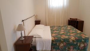 En eller flere senge i et værelse på Il Giardino del Nespolo