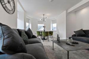 a living room with a couch and a table at Mode Apartments Blackpool in Blackpool