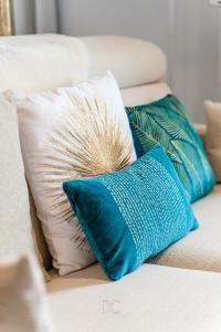 a grouping of pillows on a couch at *DISNEYLAND-SERRIS* 4 pers Cosy apartment in Serris