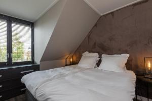 Postel nebo postele na pokoji v ubytování Luxe apartment - Ooststraat 18b Domburg