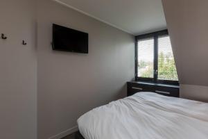 Postel nebo postele na pokoji v ubytování Luxe apartment - Ooststraat 18b Domburg