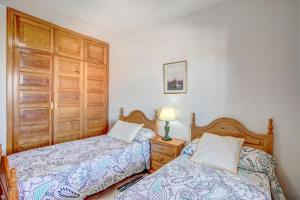 Postel nebo postele na pokoji v ubytování Apartamento Atlantic View + 16 fotografií
