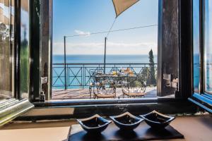 a view of a table and chairs from a window at Xigia Escape villas in Khartáta