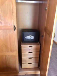 a small television sitting on a dresser in a closet at MAGNET - private chalet in Razlog