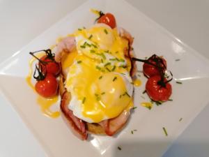 a plate of food with eggs and tomatoes on it at No 12 B&B in Dungarvan