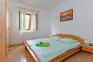 Postel nebo postele na pokoji v ubytování Ripenda Apartments