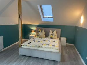 a bedroom with a bed with a mirror on it at Apartamenty u Tatiany in Międzywodzie