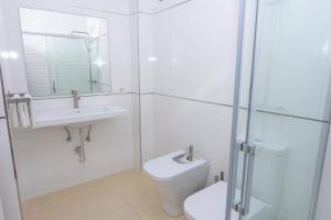 a bathroom with a toilet and a sink and a shower at Miramar - Goya in Carboneras