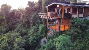 a tree house in the middle of a mountain at HBG Glamping community Yoga & Wellness space in Santa Teresa Beach