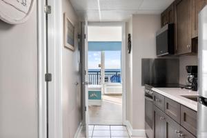 a kitchen with a view of the ocean at 11-th Floor OcenView w Balcony cozy condo at Boardwalk Resort in Myrtle Beach