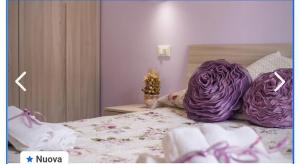 A bed or beds in a room at Appartamento francy