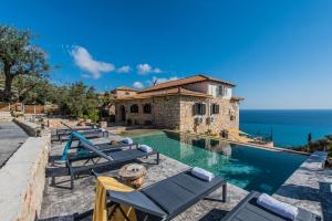 an image of a villa with a swimming pool at Xigia Escape villas in Khartáta